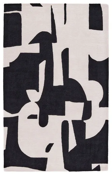 Abstract black and cream area rug with bold color block design and textured plush weave