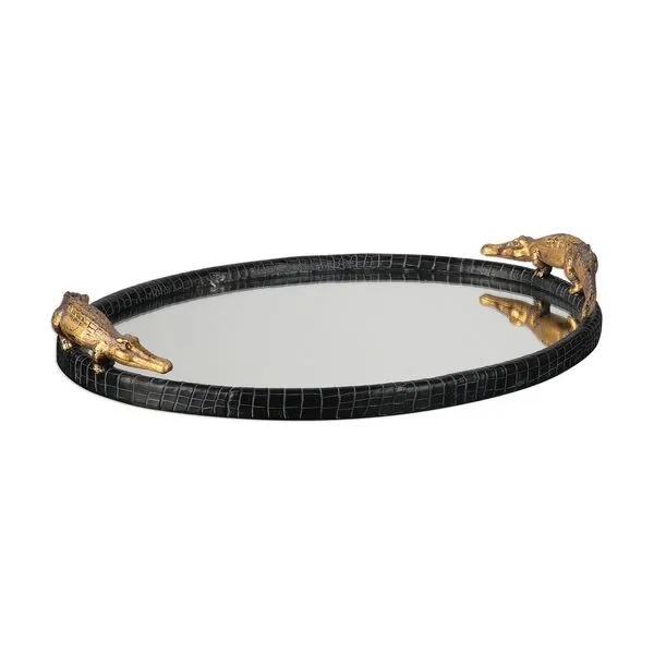Round mirrored tray with black alligator texture frame and two golden alligator figurines on opposite sides