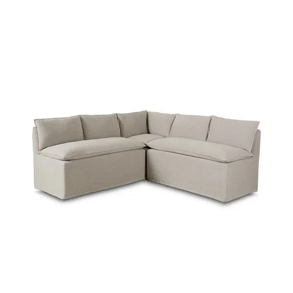 Modular slipcovered L-shaped dining banquette in neutral flax linen with flanged top seams and feather-blend cushions