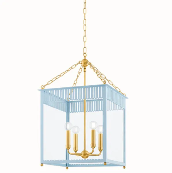 Side angle of Soft Arctic Blue Rosalie Lantern highlighting brass hanging chain and rounded light bulb sleeves