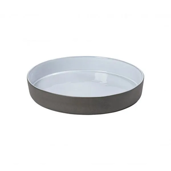 Round white bowl with smooth glazed interior and matte gray exterior, shallow with slightly raised edges