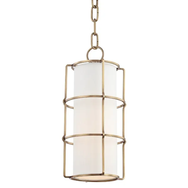 Tall pendant light with cylindrical white fabric shade encased in bronze metal cage frame hanging from adjustable chain