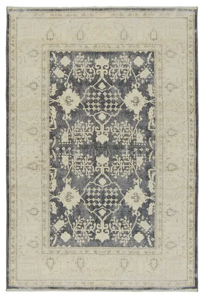 Traditional navy and cream area rug with Persian-inspired medallion and ornate floral border in distressed style