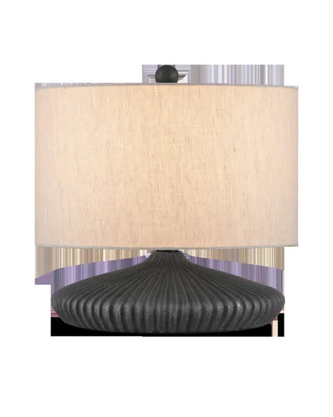 Mythmaker Table Lamp with a squashed circular terracotta base in black granite finish and a beige fabric drum shade