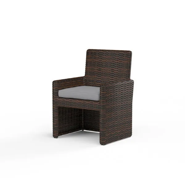 Montecito armless outdoor dining chair in Cognac multi-colored woven resin wicker with gray seat cushion
