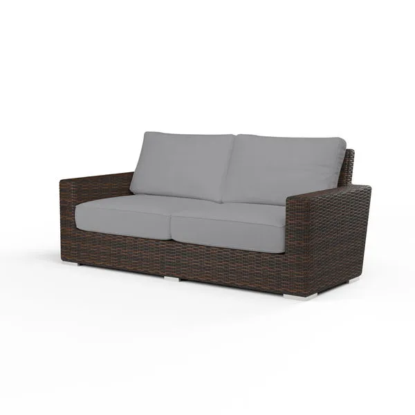 Montecito Loveseat outdoor sofa with cognac multi-colored resin wicker frame and gray cushioned seat and back