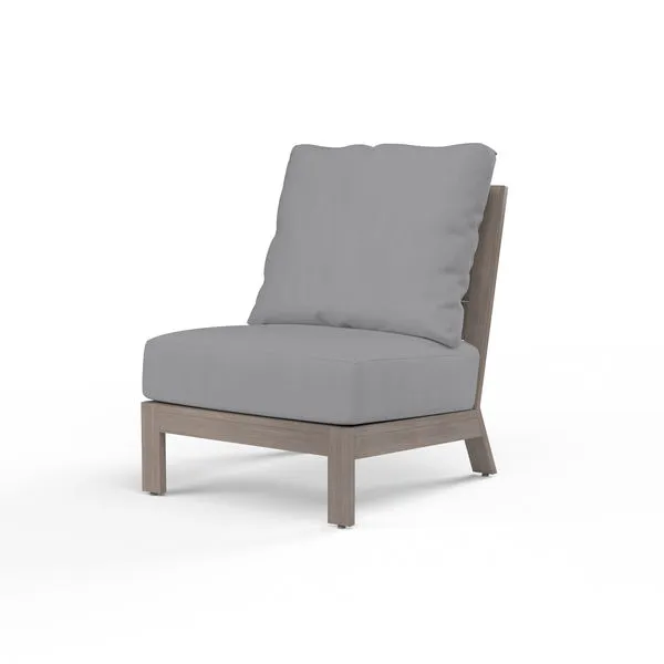 Laguna Armless Club chair with hand-brushed driftwood-look aluminum frame and gray outdoor cushions