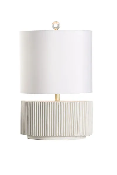 Porticello table lamp with short cylindrical ceramic base featuring irregular vertical fluting in matte white glaze and wh...