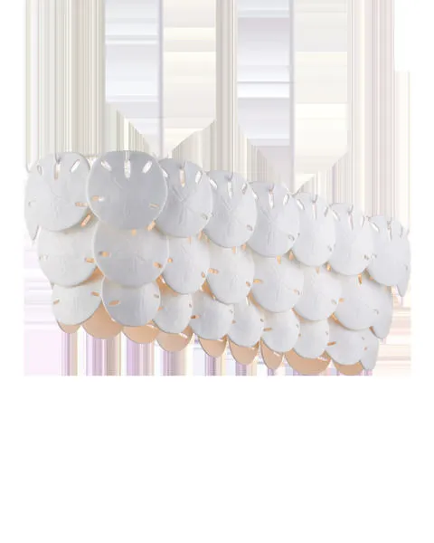Oval chandelier featuring overlapping semi-translucent white sand dollar shapes in bone china with warm light
