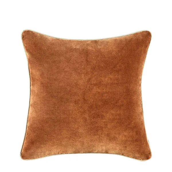 Square burnt orange velvet throw pillow with soft antique wash and neutral piping