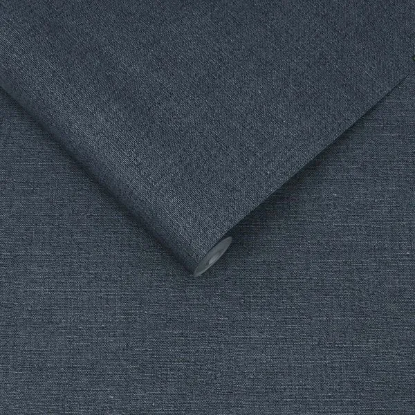 Navy blue Haptic wallpaper with plain, finely textured surface, shown rolled and flat