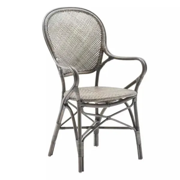 Rossini rattan dining armchair with curved backrest, woven seat and back, and rounded armrests in natural rattan finish