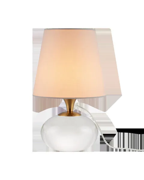 Diantha Table Lamp with polished optic crystal orb base, antique brass neck, and white tapered fabric shade