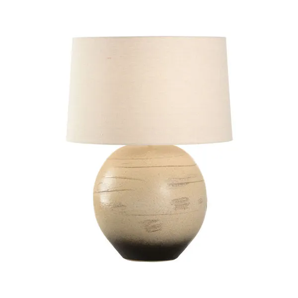 Moriko Lamp with round sandy clay base featuring subtle horizontal texture and ombré from beige to black, topped with a cr...