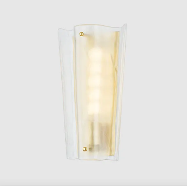 Baxford Sconce mounted on a wall showing the warm light glow and translucent glass edges