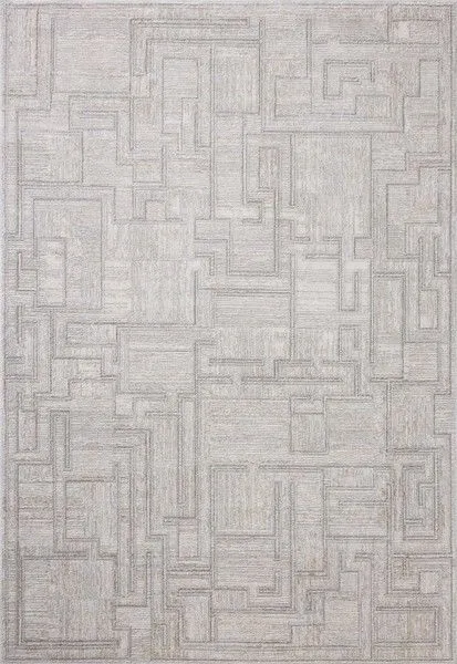 Ivory-toned modern area rug with geometric motifs and fringed edges, power-loomed for durability