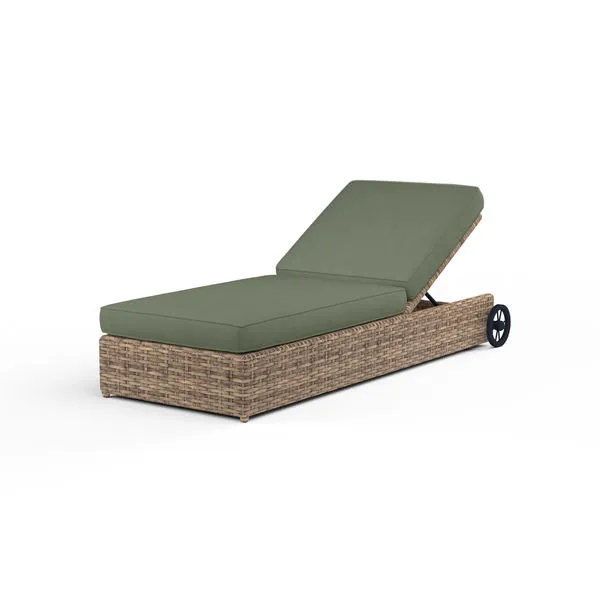 Outdoor chaise lounge with adjustable backrest, weathered tobacco wicker frame, and olive green cushions