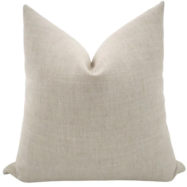 Square pillow cover in soft alabaster beige polyester fabric with subtle woven texture and plump shape