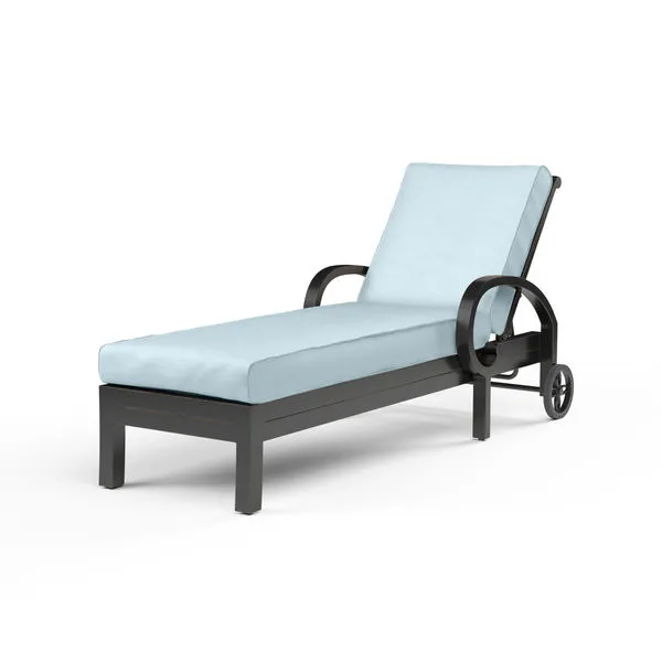 Monterey Chaise Lounge in espresso powder-coated aluminum with light blue cushion and curled arm design
