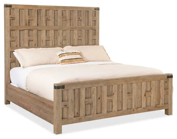 King-size wooden panel bed with cutout fretwork headboard and footboard in light Sonoma finish with hammered metal accents