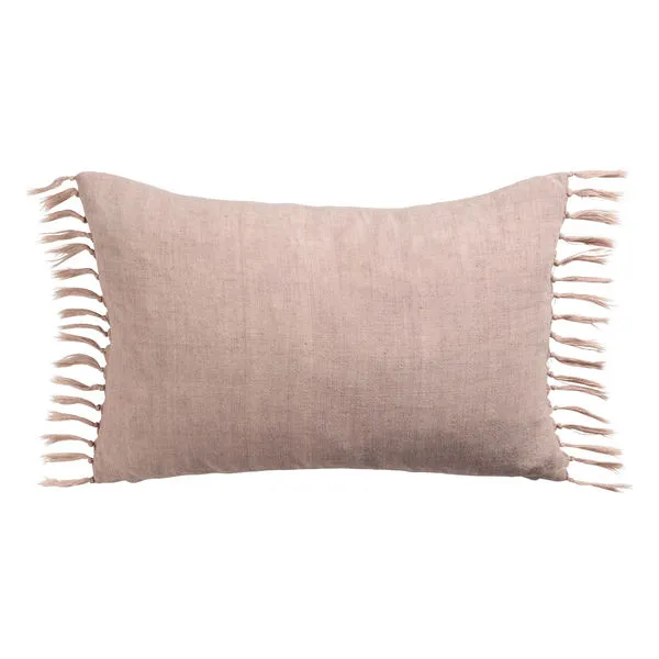 Rectangular blush pink linen throw pillow with rustic knotted tassels along the sides