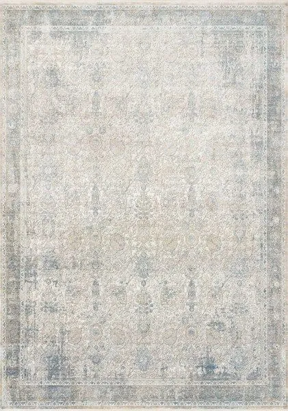 Traditional ivory and light blue rug with subtle patina and intricate floral-inspired design in a soft, silky texture