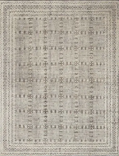 Rectangular Origin Grey and Ivory rug with intricate geometric and tribal patterns in a faded vintage style