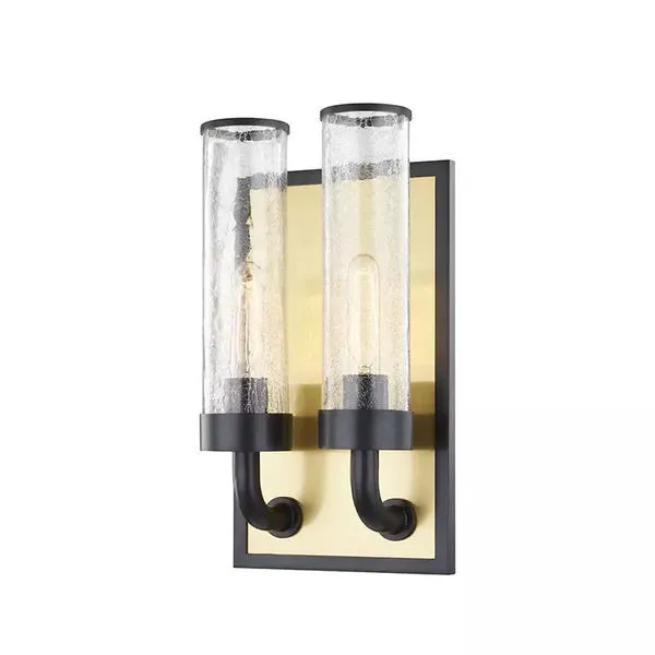 Soriano 2 Light Wall Sconce with two clear textured glass cylindrical shades on curved black arms against a rectangular go...