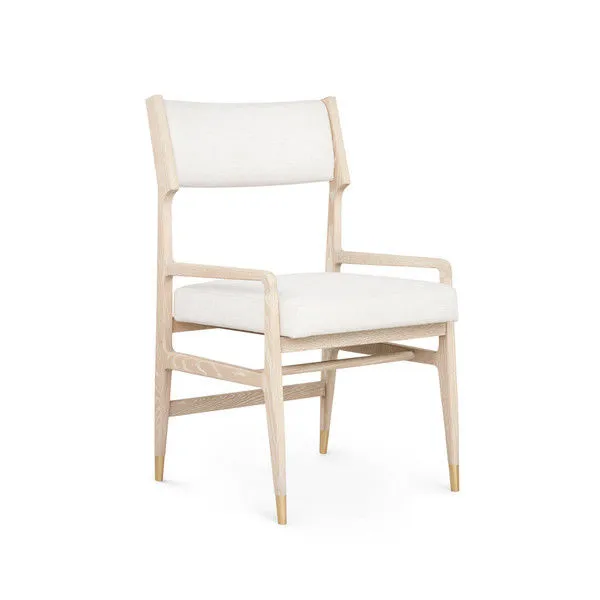 Renata Arm Chair with bleached cerused oak wood frame, sand fabric upholstery, and brass-tipped legs.