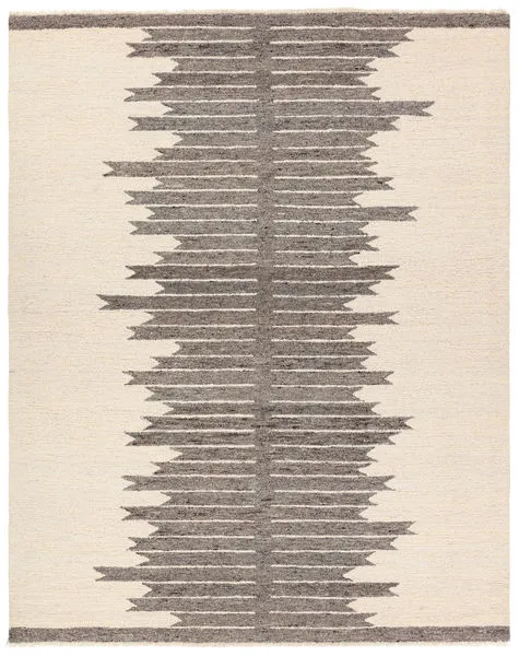 Hand-tufted rug with cream background and central column of dark gray striped Moroccan-inspired pattern