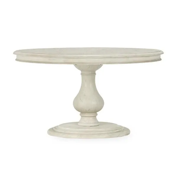 54-inch round dining table with solid wood construction, light tone, and intricately carved pedestal base