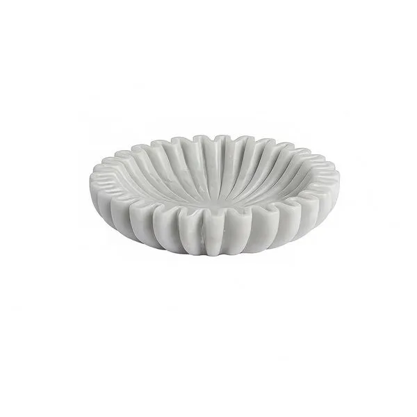White fluted marble bowl with sculpted ridges and subtle veining, shallow round shape with a refined finish