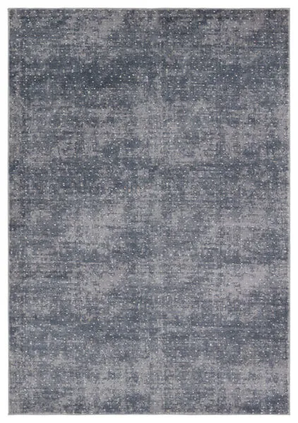 Rectangular Modern Rug in dotted blue, cream, and tan with a textured high-low pile, size 7'10" x 10'