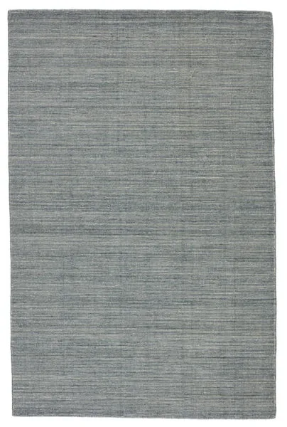 Low-profile handwoven indoor/outdoor rug in a heathered dark blue and gray polyester weave with subtle horizontal texture