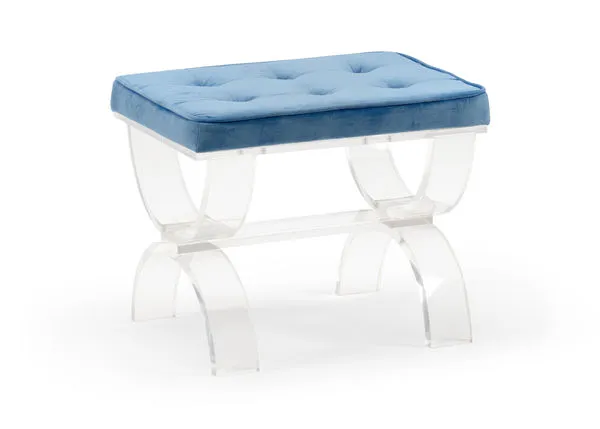 Clear acrylic bench with curved legs and a blue velvet tufted cushion