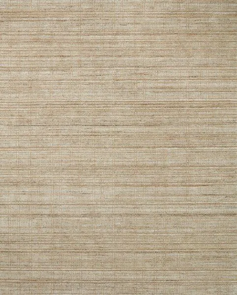 Jamie Natural Sand Rug with hand-loomed jute and polyester fibers in a warm sand tone with subtle abrash color variation