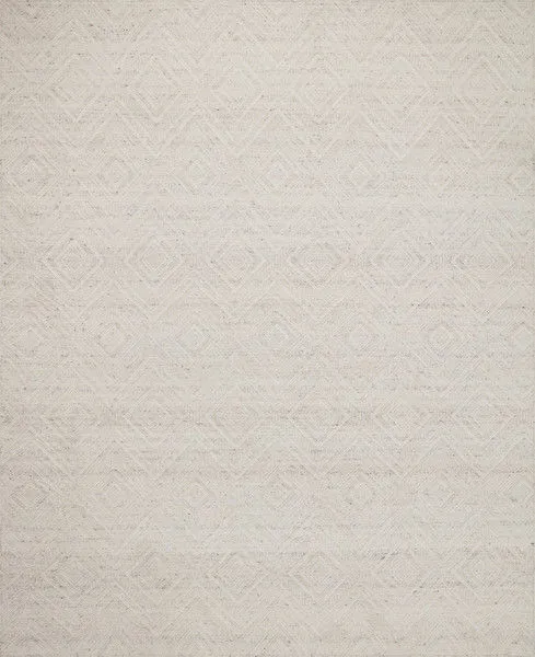 Ivory pebble rug with layered geometric diamond patterns in a textured, handwoven design