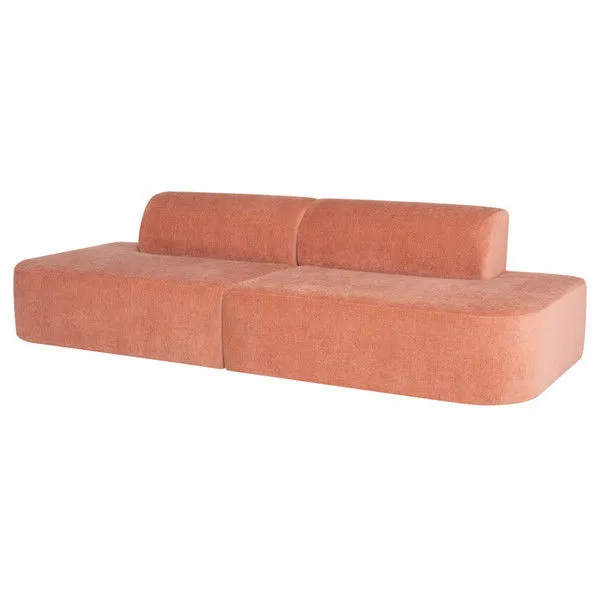 Modern minimal Isla Sofa in muted terracotta fabric with gently arched back and rounded base
