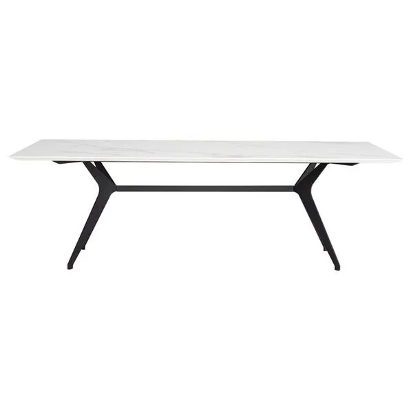 Front view showing full length of white ceramic tabletop and black metal legs of Daniele dining table