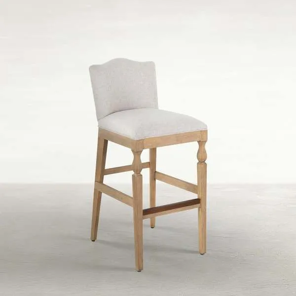 Gaston Upholstered Wooden Stool with slipaway sand fabric seat and curved back, rustic French Oak frame with classic turne...