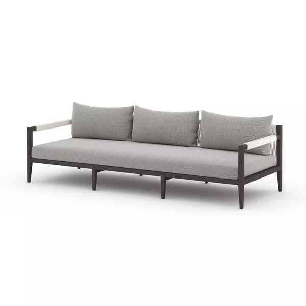 Sherwood 93-inch Faye Ash outdoor sofa with dark aluminum frame, gray Sunproof fabric cushions, rope-wrapped armrests