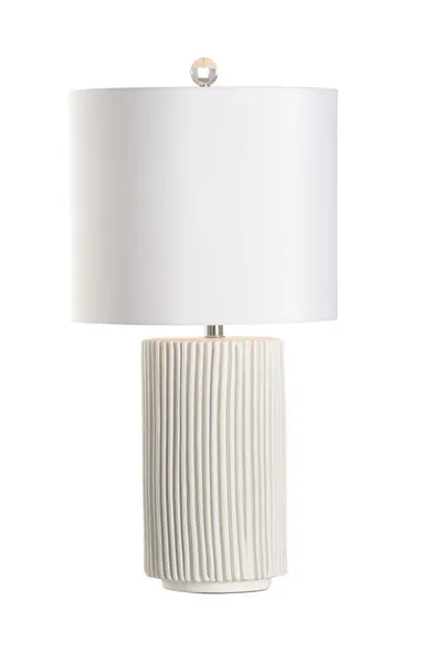 Matte white ceramic Pozzallo table lamp with cylindrical base featuring irregular vertical fluting and a white drum shade
