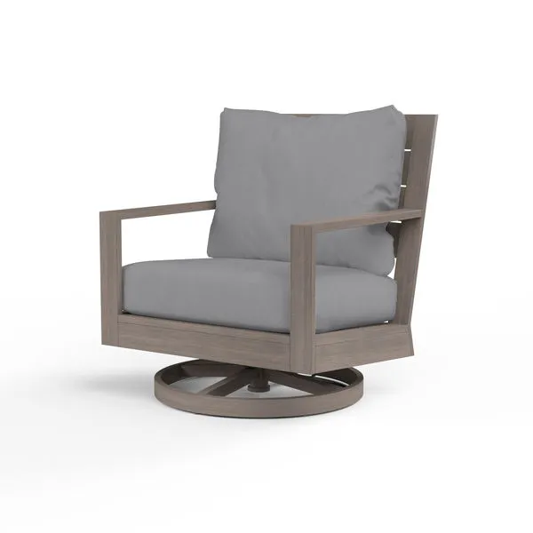 Laguna Swivel Club Rocker with driftwood-style aluminum frame and gray cushioned seat and backrest