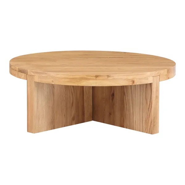 Folke round coffee table in solid white oak with a thick top and intersecting vertical base panels