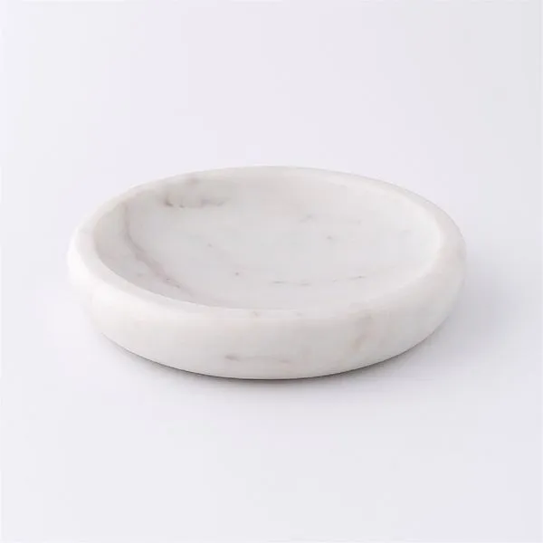 Large round white marble tray with smooth polished surface and subtle grey veining
