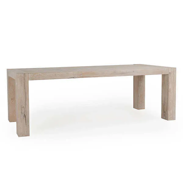 Kingston dining table in reclaimed oak with thick block legs and plank-style top showing natural wood grain and color vari...