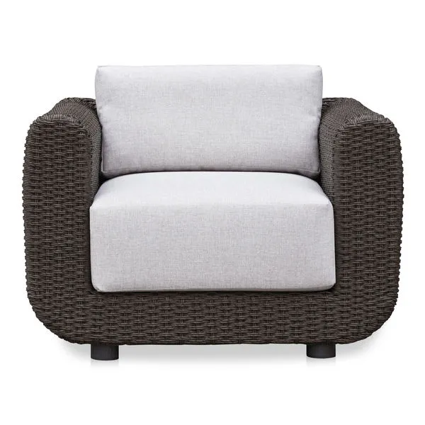 Soma outdoor accent chair with dark brown woven PE wicker frame and light heathered Olefin fabric cushions