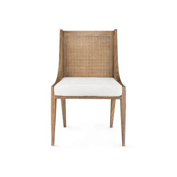 Front view highlighting square white cushion and woven cane backrest on Raleigh Armchair