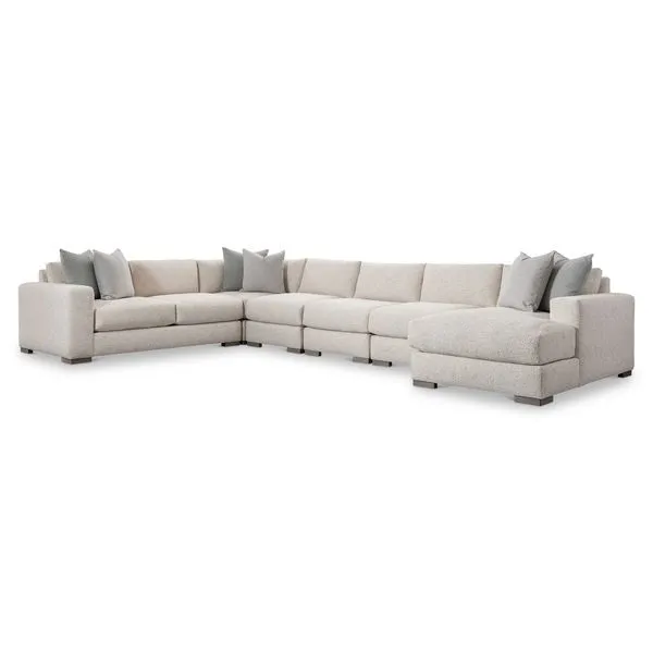 Drew 6-piece fabric sectional with neutral upholstery, fiber back pillows, accent pillows, and chunky wooden legs