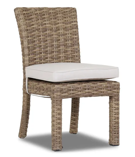 Armless outdoor dining chair with aged tobacco all-weather wicker and off-white cushioned seat
